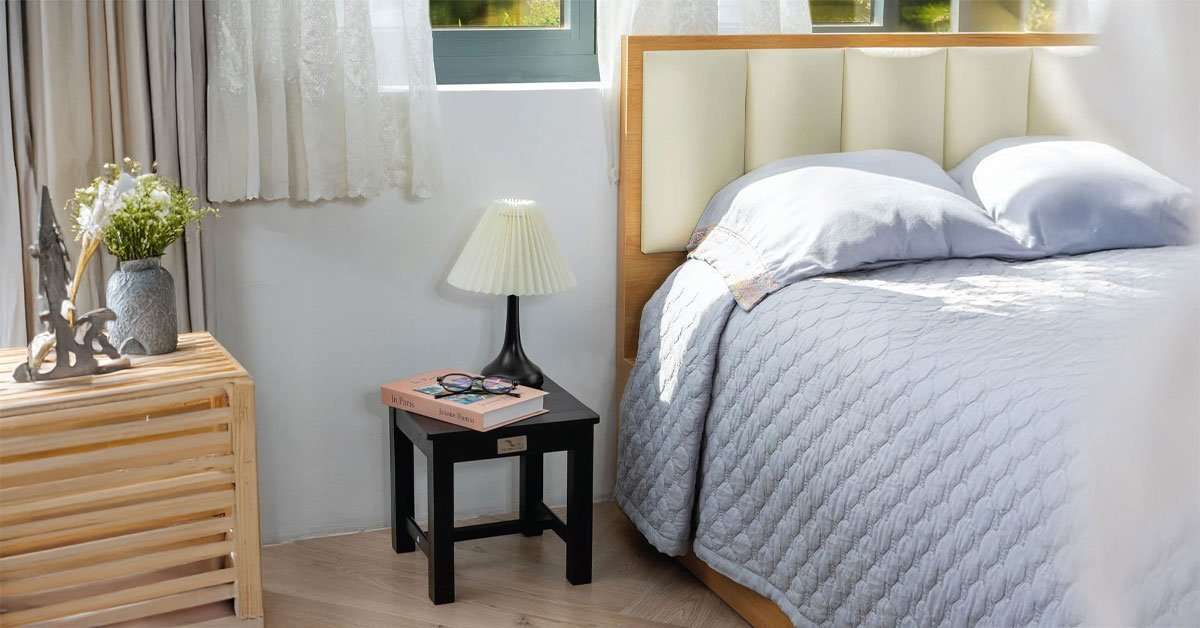 Acacia wood step stool showing non-slip surface and stable flat base