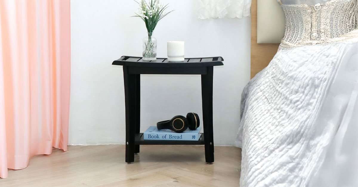 2-tier acacia shower stool in a walk-in shower with storage shelf holding bathroom products