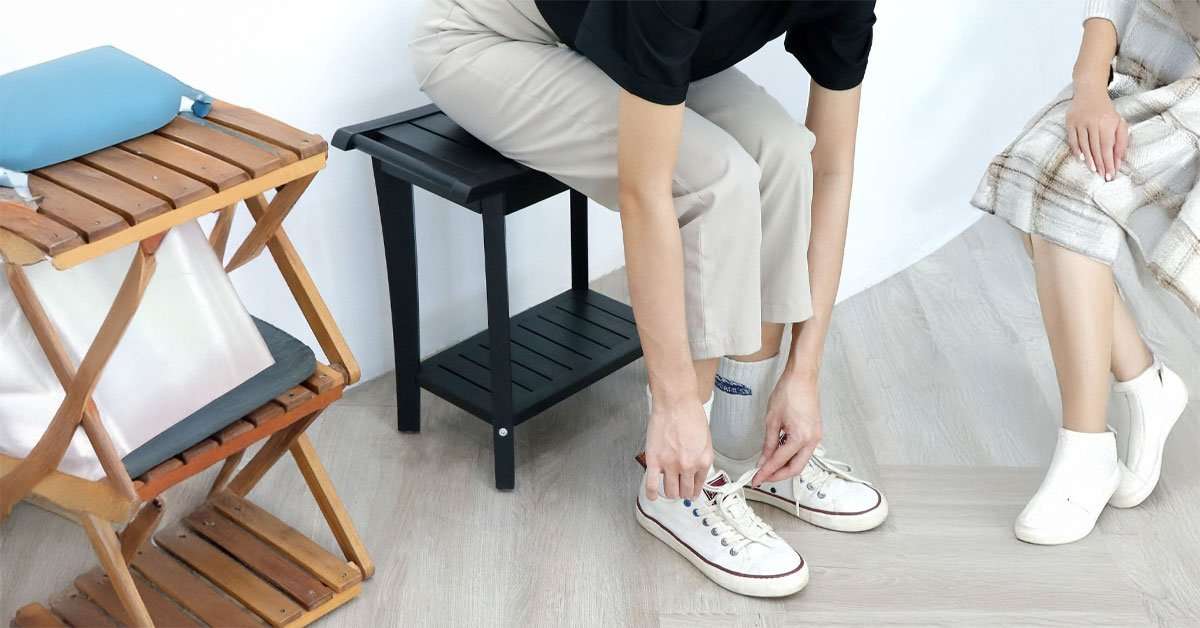 Acacia shower stool slatted seat detail showing water drainage design and natural finish