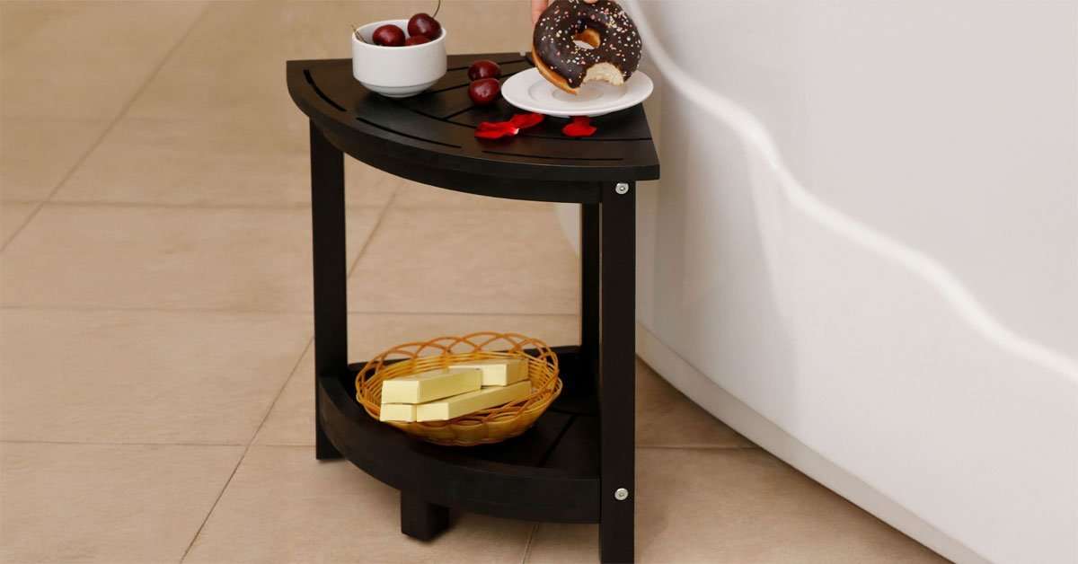 corner shower stool in use in a modern tiled walk-in shower with easy corner fit