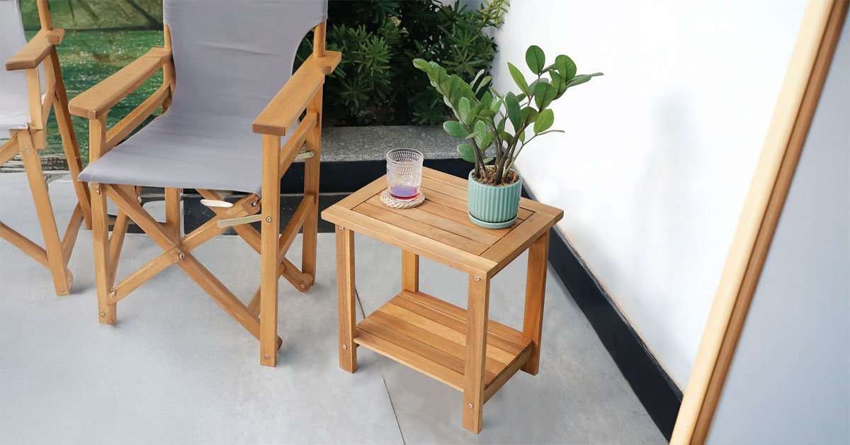 adirondack side table placed between two Adirondack chairs on an outdoor patio