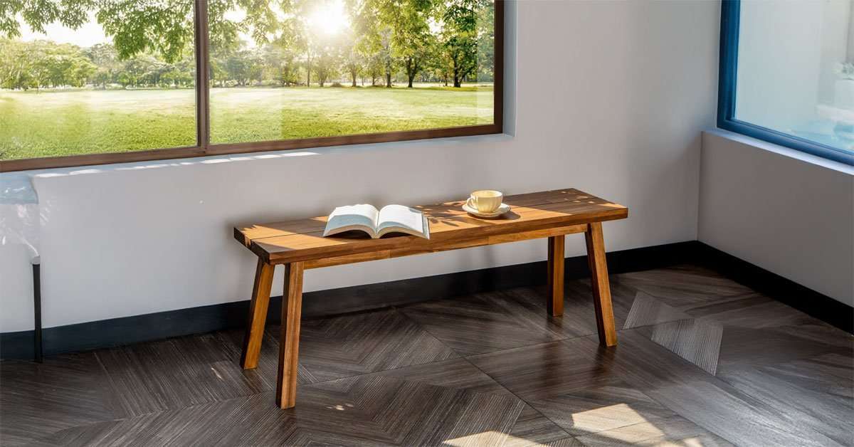Assembled solid acacia wood bench ready for use in a living room or bedroom