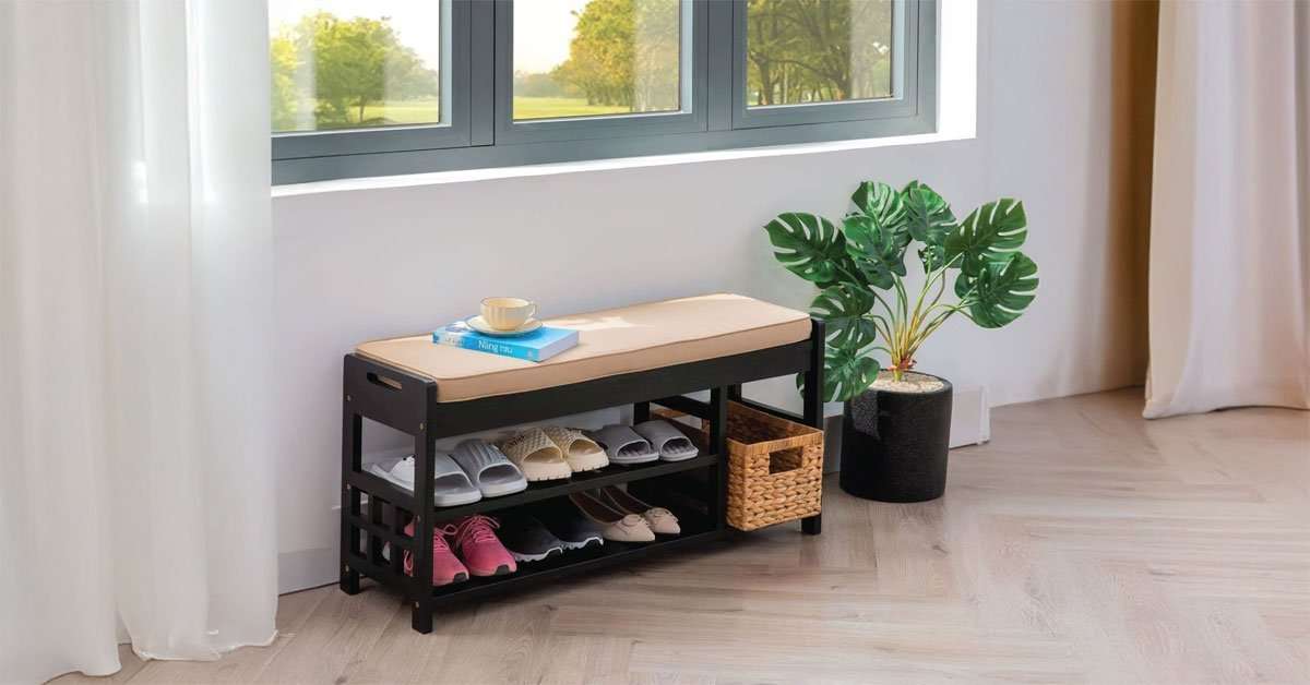 Wooden shoe bench in an entryway with shoes stored underneath and seating on top