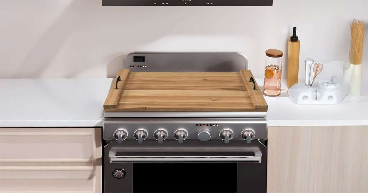 Noodle Board Stove Cover – Stylish Wooden Stove Top Cover & Kitchen Organizer 1 Noodle board stove cover placed over gas stovetop extending counter working space