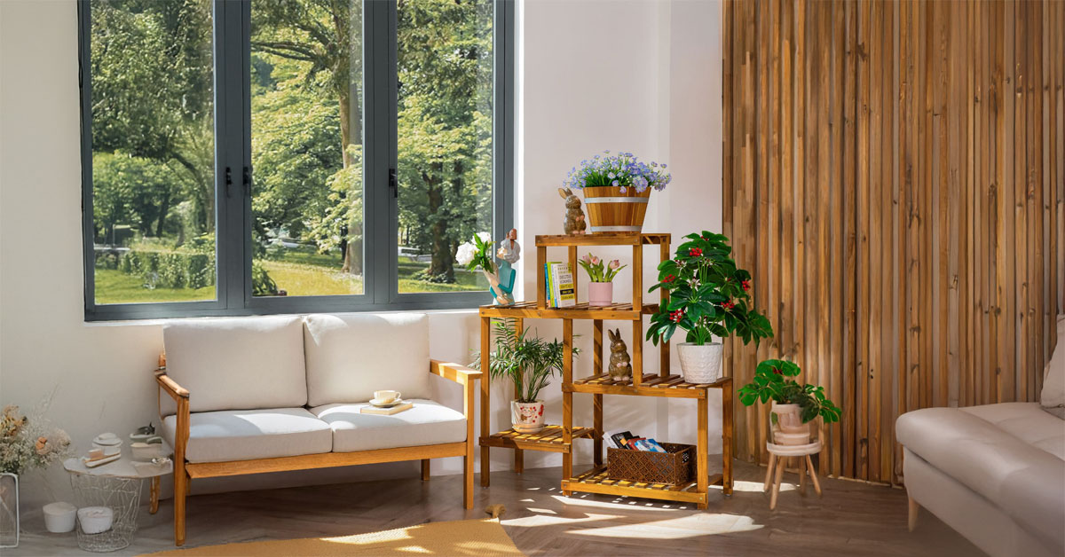 living room styling tips with natural wood plant stand and greenery