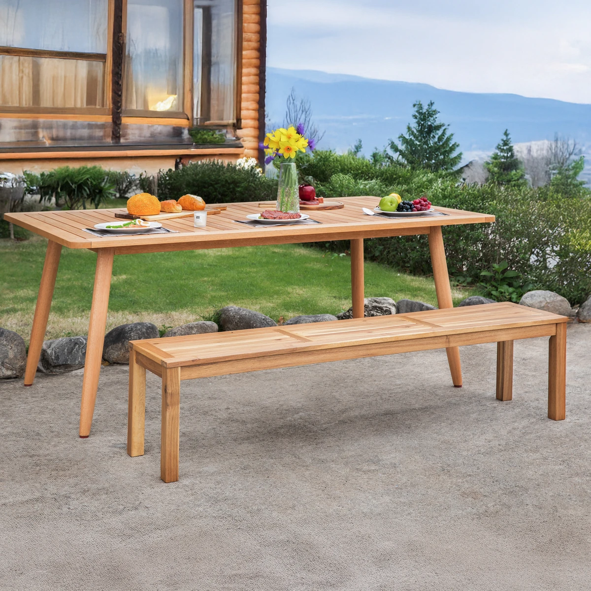Acacia wood bench in an outdoor patio dining setting