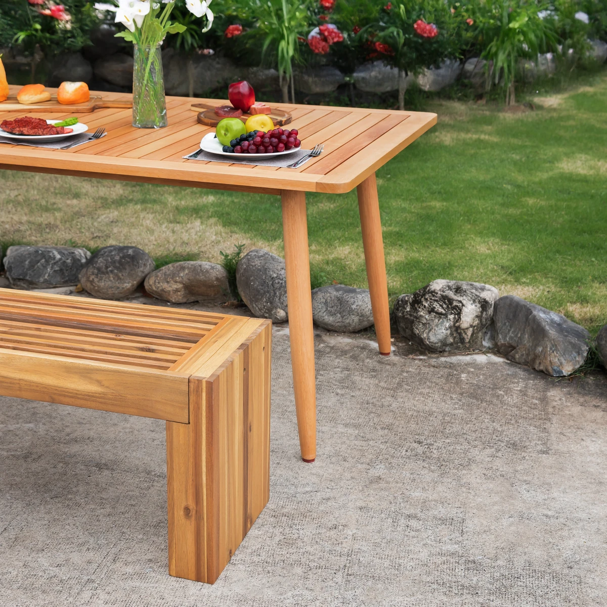 Acacia wood bench used as outdoor seating in a garden setting
