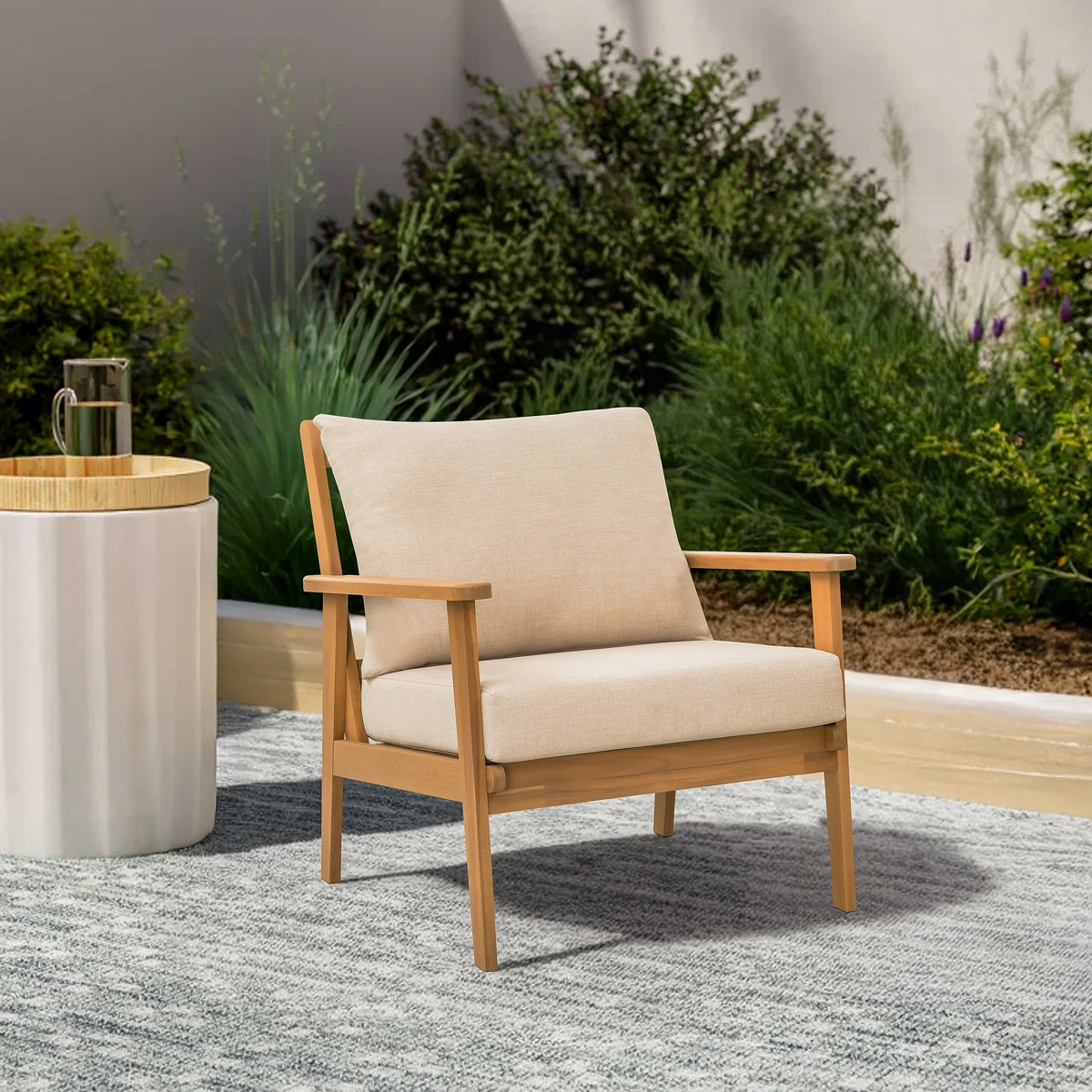 Solid wood patio lounge chair beside a garden side table