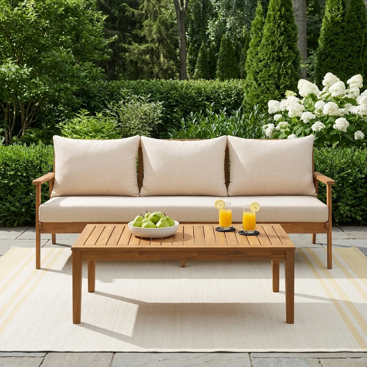 Outdoor sofa with removable cushions on a garden patio