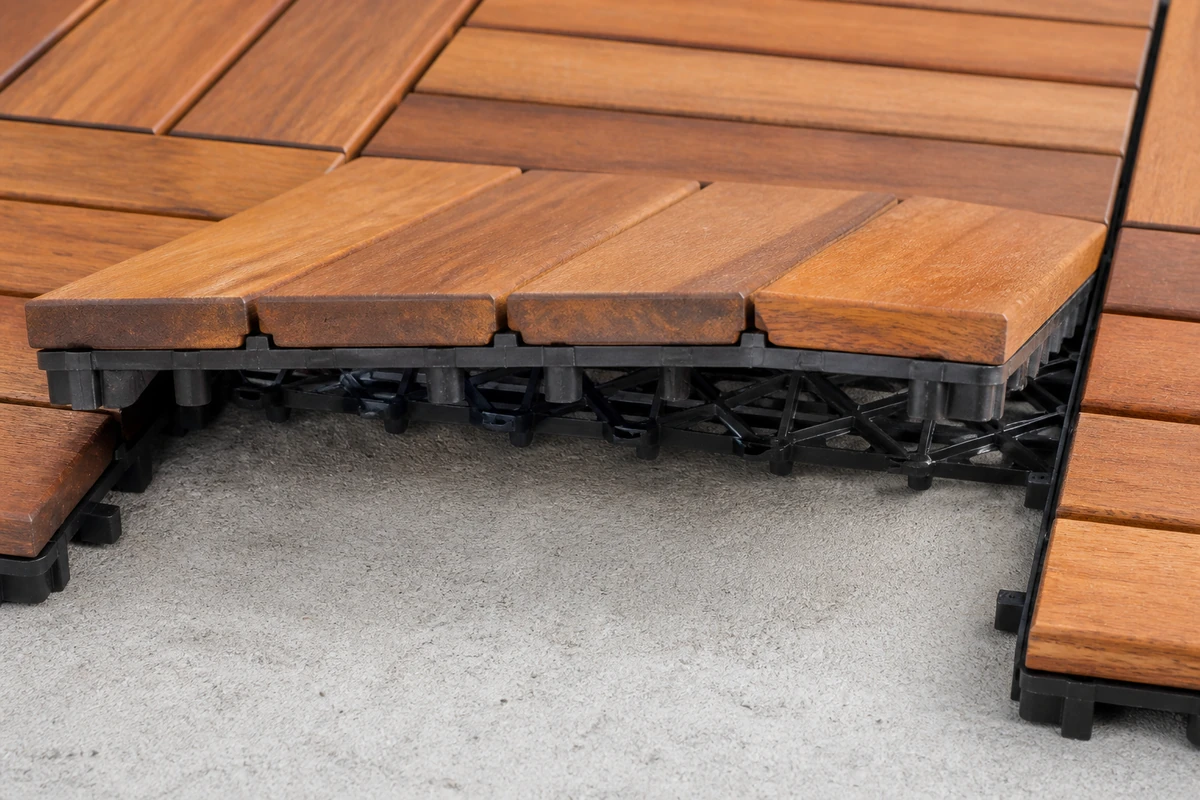 Wood deck tile backing and drainage gap over concrete