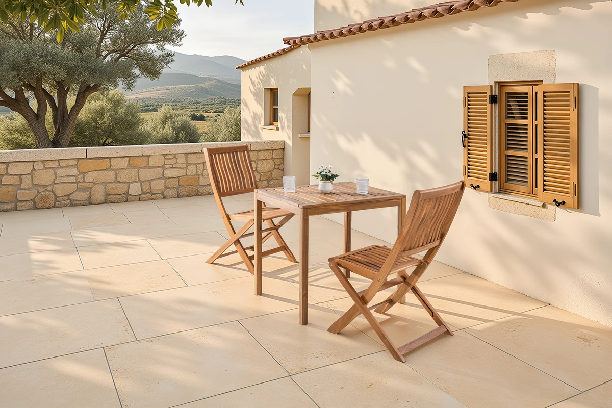 Pair of eucalyptus folding chairs arranged on a sunny patio