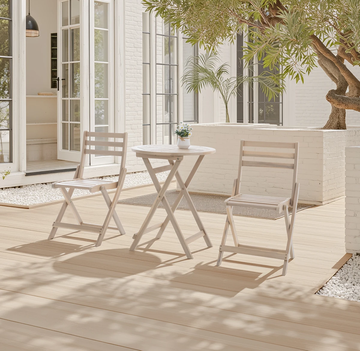White Wash wood folding bistro set on a bright patio
